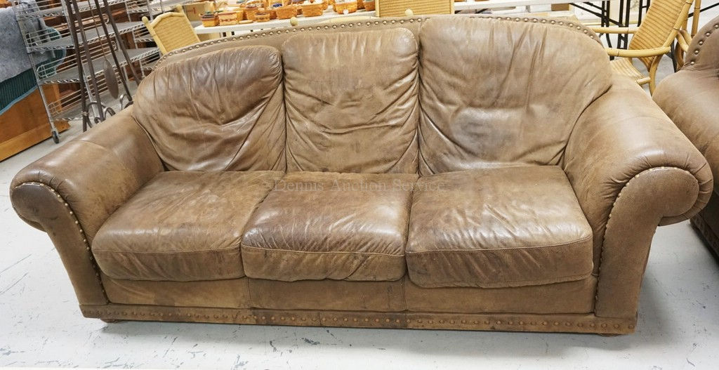 BROWN LEATHER SOFA.