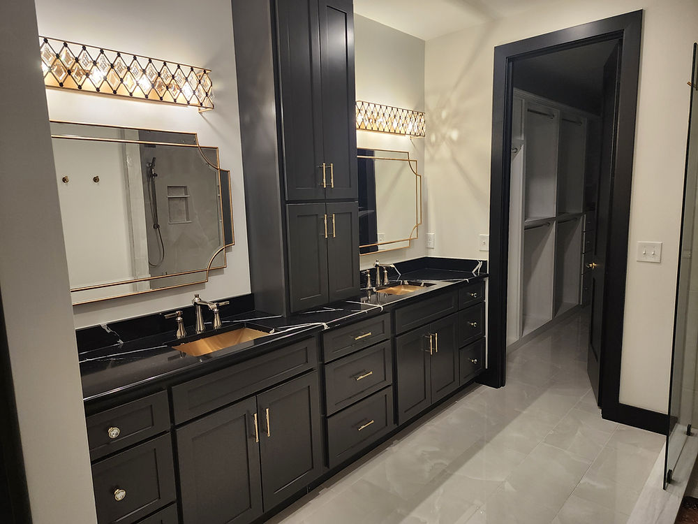 Dark gray master bathroom double vanity with stacked upper cabinets, art deco mirrors, and copper undermount sinks