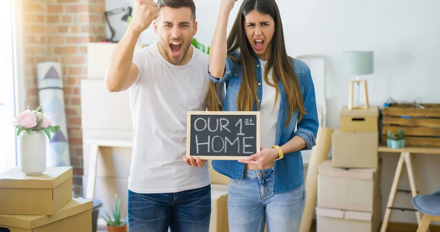 excited-couple-in-first-home.webp