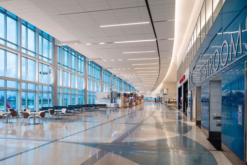 Modern airport terminal interior with expansive windows and sleek architectural design photographed by Randy Van Duinen.