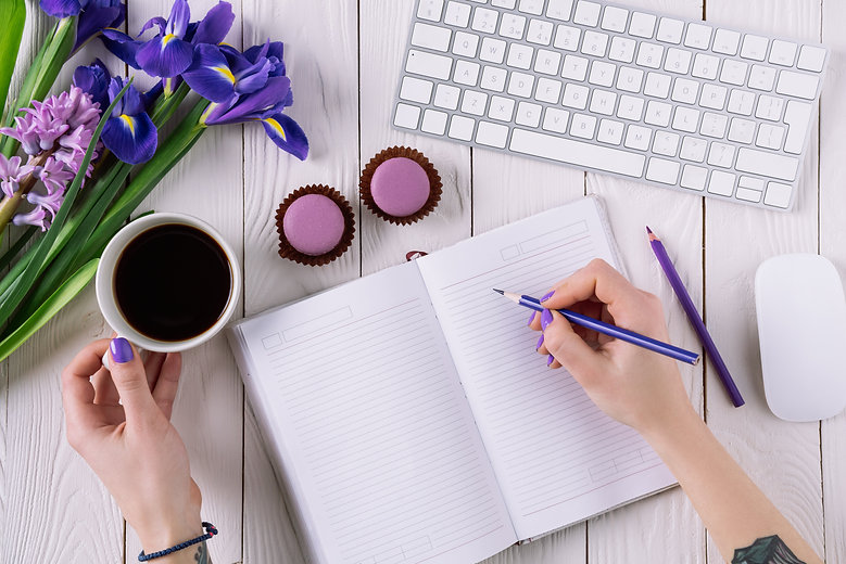 Note book and a cup of coffee.