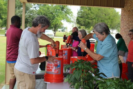 Ag & Stewardship Club visitors create container gardens with everyday materials.
