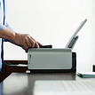 Man Using Computer Printer