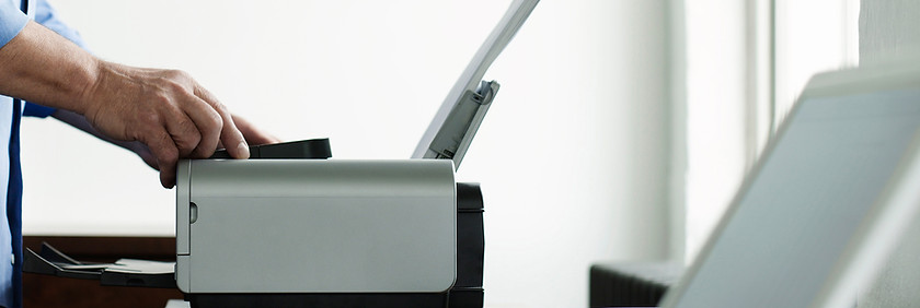 Man Using Computer Printer