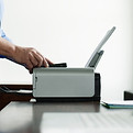 Man Using Computer Printer