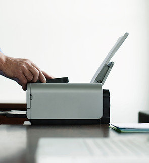Man Using Computer Printer