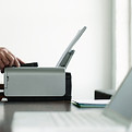 Man Using Computer Printer