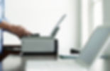 Man Using Computer Printer