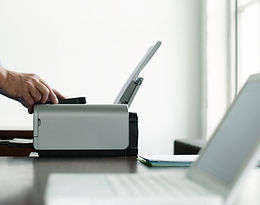 Man Using Computer Printer