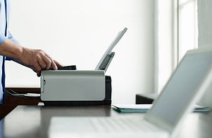 Man Using Computer Printer