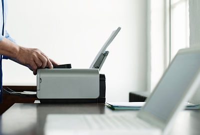 Man Using Computer Printer