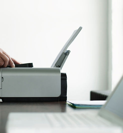 Man Using Computer Printer