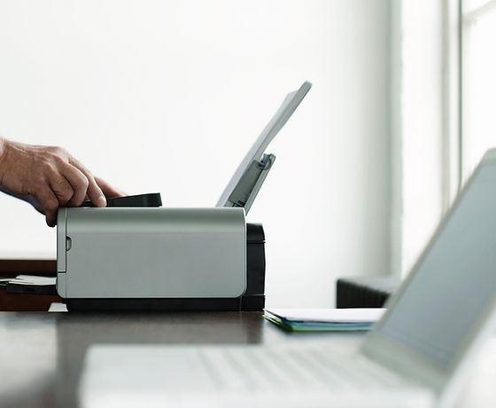 Man Using Computer Printer