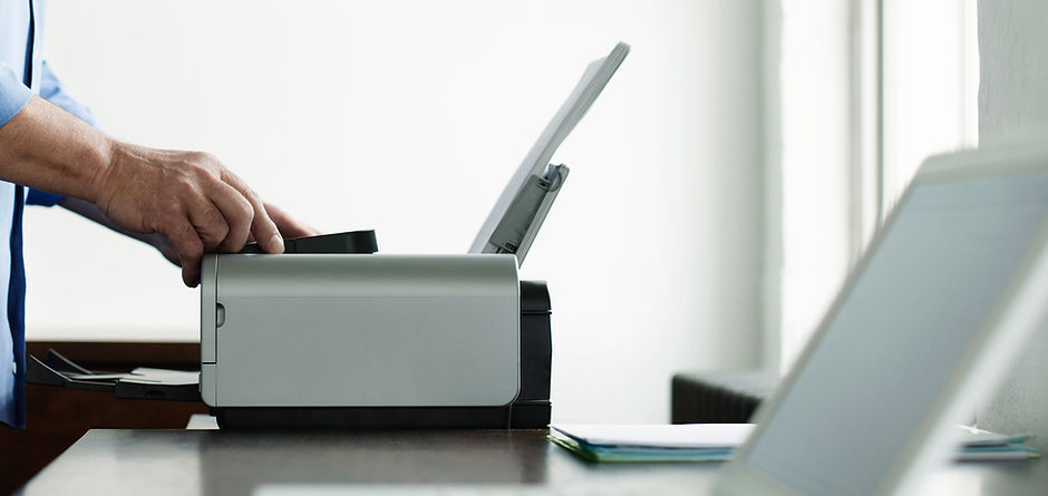 Man Using Computer Printer
