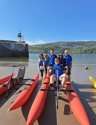 Group of aquabikers near Raglan Pier about to have fun in Port Erin Bay