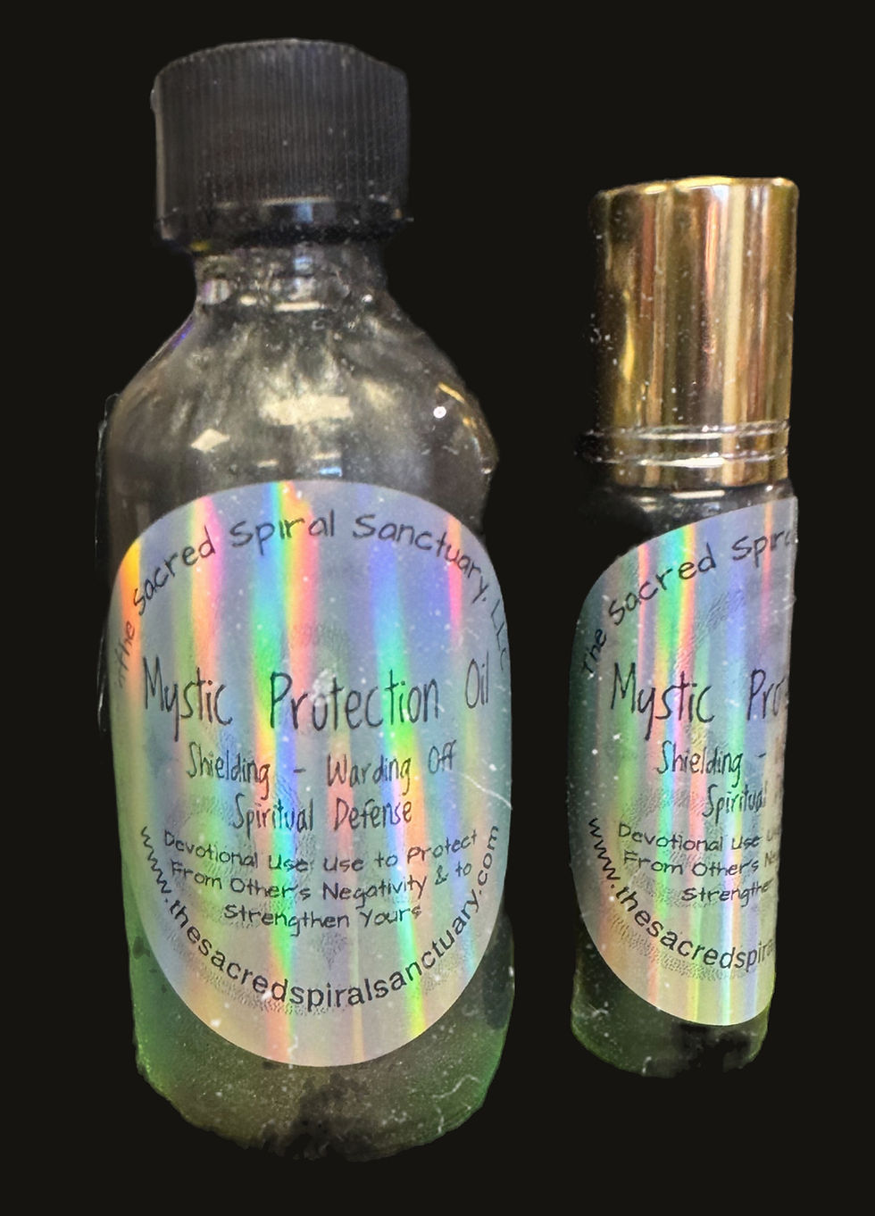 Mystic Protection Oil bottle with herbs and crystals for aura cleansing and spiritual protection.