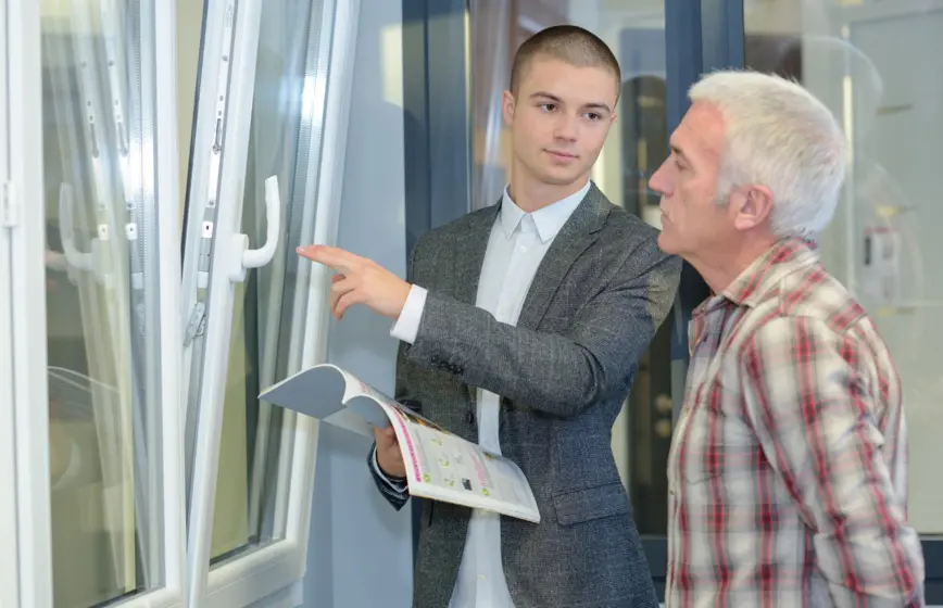 A customer inspects an energy-efficient window.