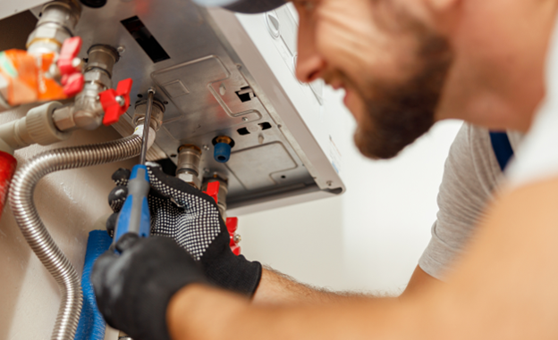 A licensed HVAC fixes boiler issues.