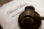 A gavel is seen on top of a divorce decree.