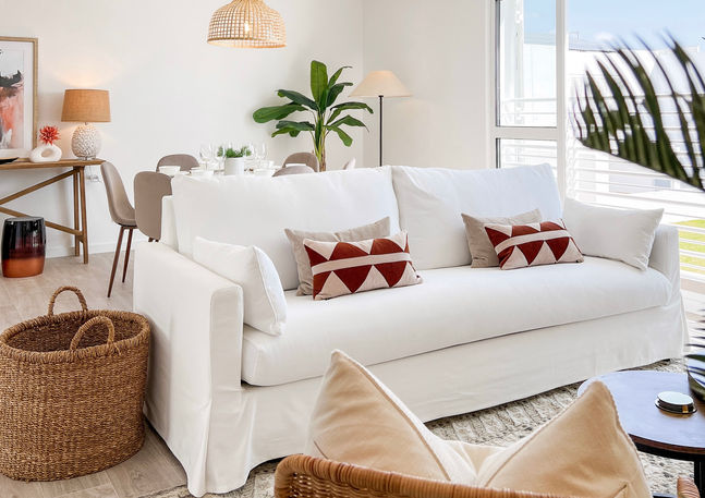 Spacious living room in Albufeira oceanfront property with stylish coastal decor and abundant natural light