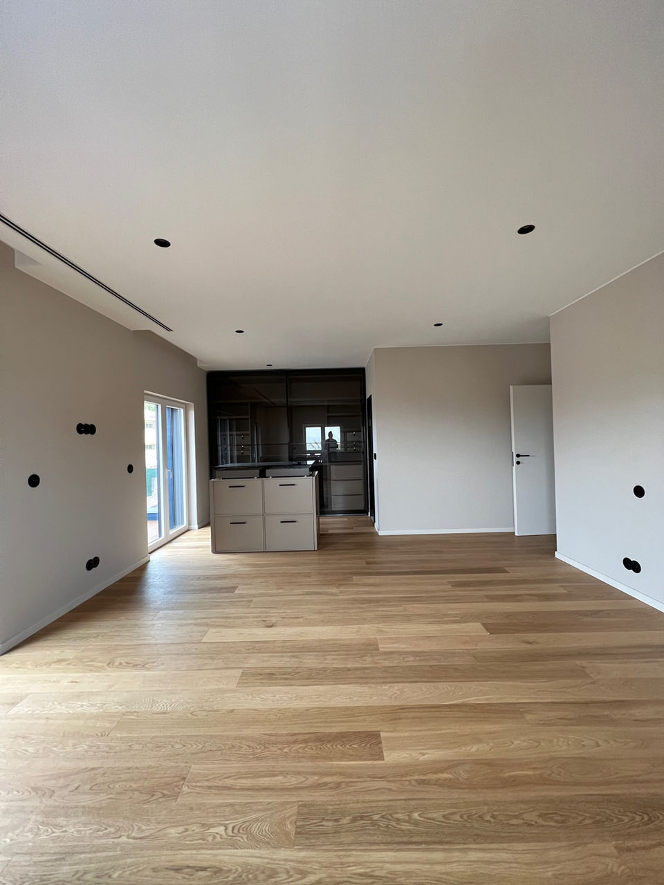 Unfurnished bedroom with a walk-in closet in with before staging.