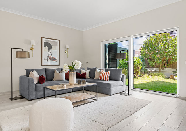 Inviting living room with elegant coastal accents in Estoril’s Alapraia, blending relaxation and sophistication for home staging