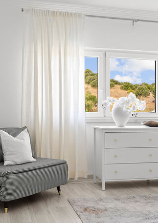 Sophisticated bedroom in Estoril, showcasing home staging that blends modern updates with timeless coastal charm