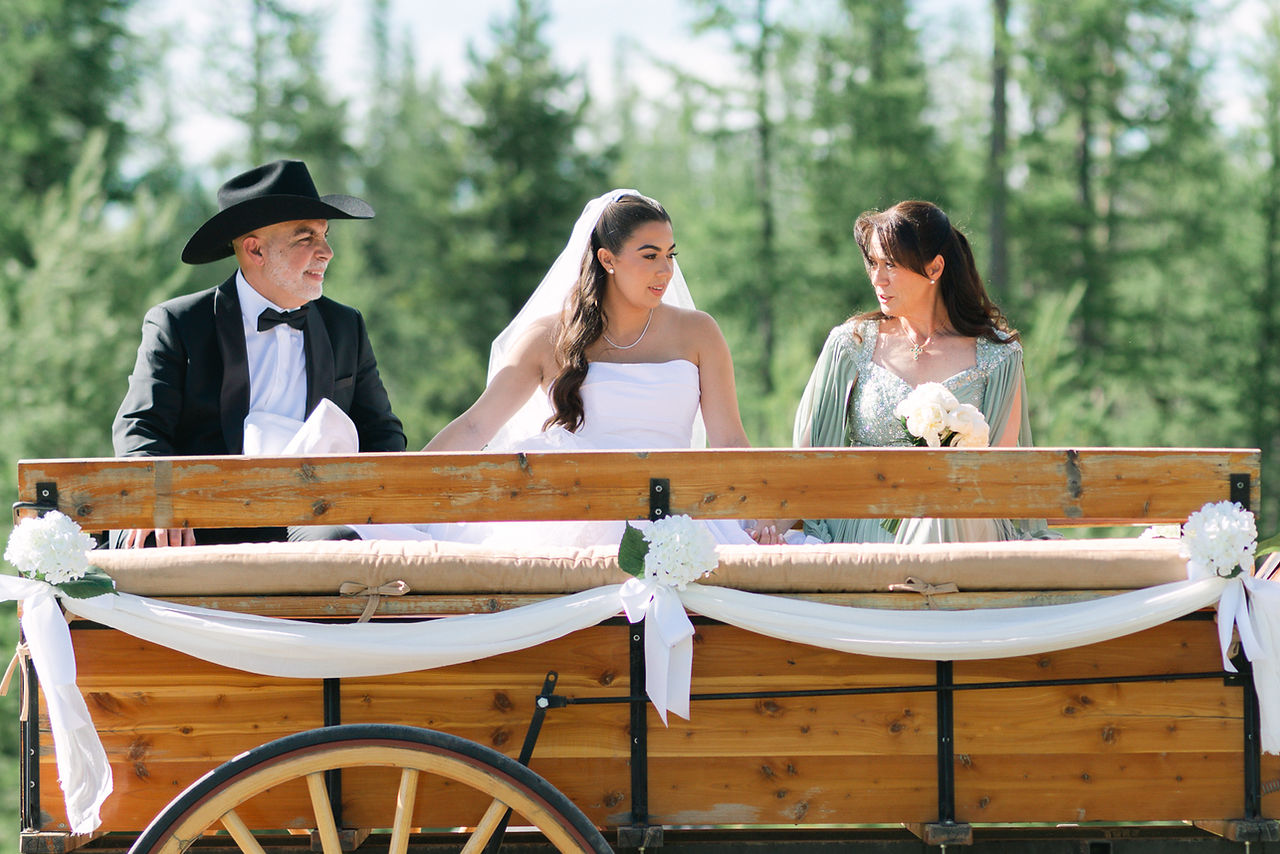 Montana wedding in Seeley Lake featuring a luxury weekend celebration with Camp Santana, a western welcome party, and an elegant lakeside ceremony with 200 guests.