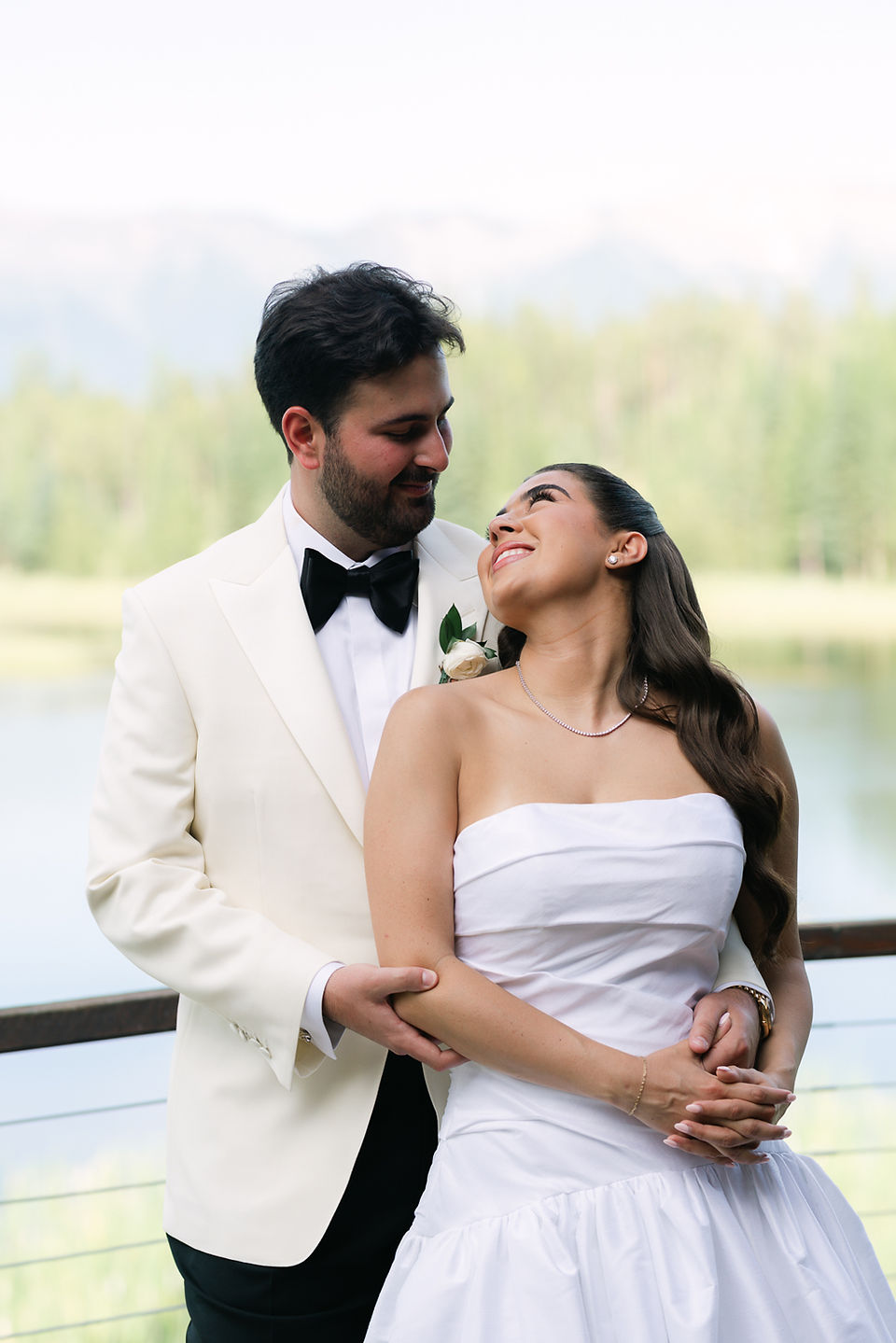 Montana wedding in Seeley Lake featuring a luxury weekend celebration with Camp Santana, a western welcome party, and an elegant lakeside ceremony with 200 guests.
