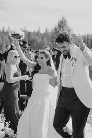 Montana wedding in Seeley Lake featuring a luxury weekend celebration with Camp Santana, a western welcome party, and an elegant lakeside ceremony with 200 guests.