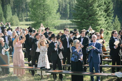 Montana wedding in Seeley Lake featuring a luxury weekend celebration with Camp Santana, a western welcome party, and an elegant lakeside ceremony with 200 guests.