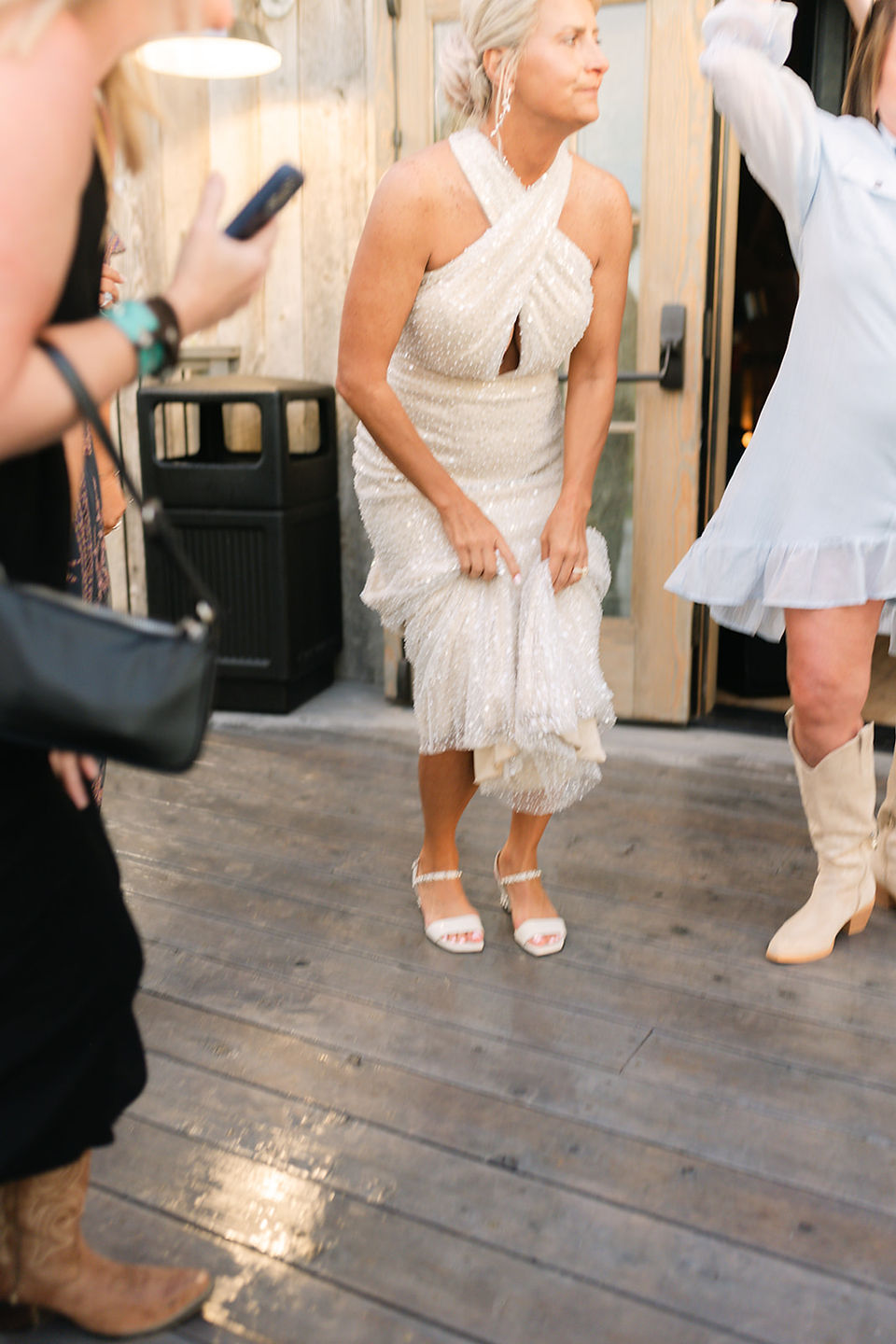 See a Bozeman Montana wedding with a helicopter at Firelight Farm, featuring epic mountain wedding photos, a helicopter entrance, outdoor ceremony and barn reception.