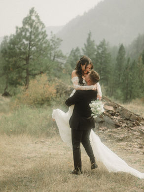 Anita & Cris laughing together during their modern Montana wedding