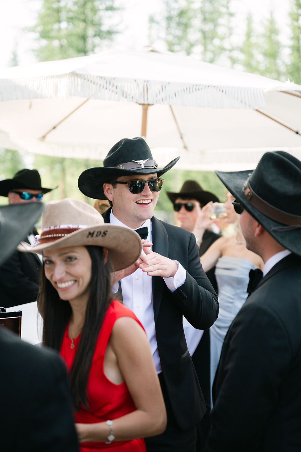 Montana wedding in Seeley Lake featuring a luxury weekend celebration with Camp Santana, a western welcome party, and an elegant lakeside ceremony with 200 guests.
