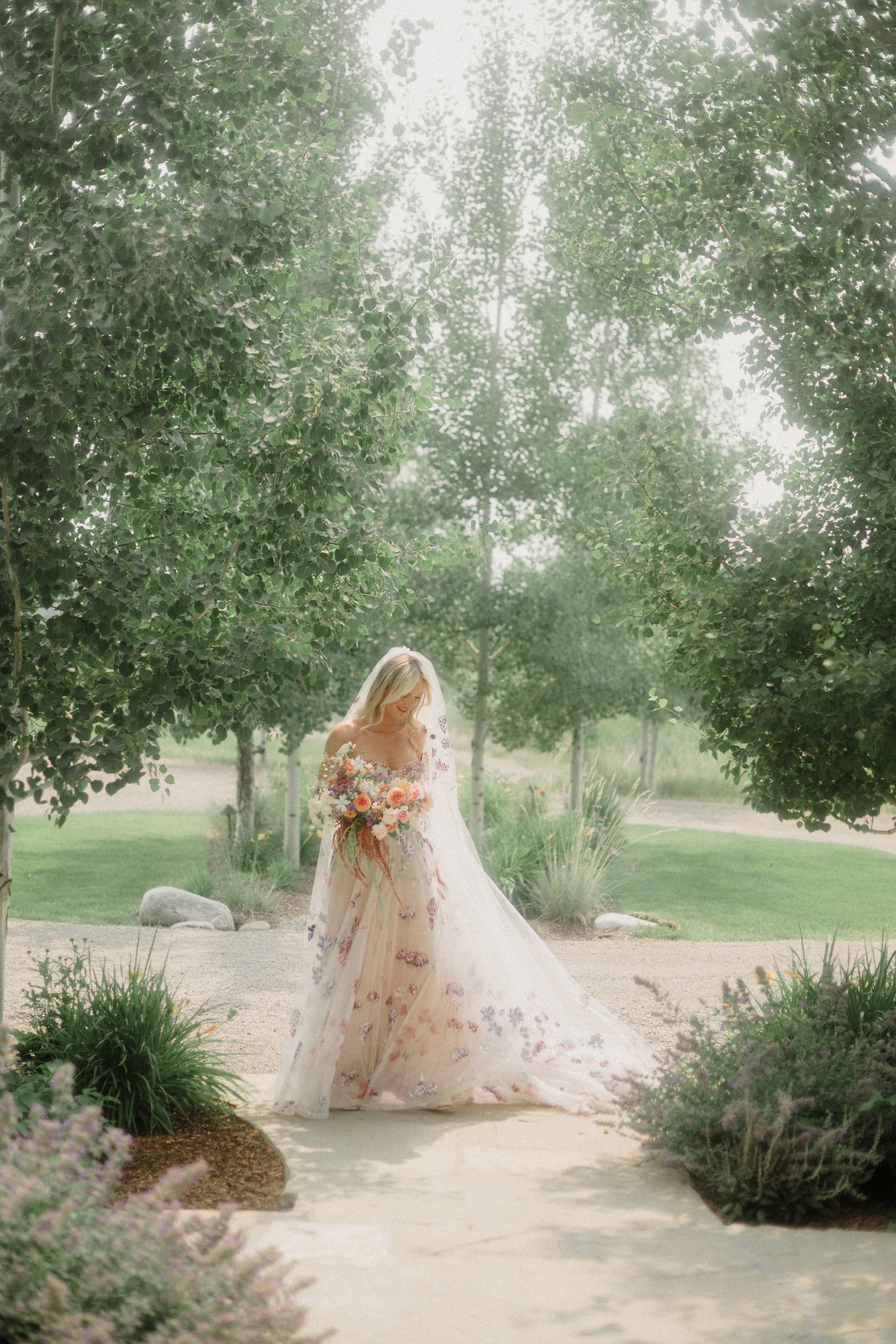 colorful and unique Montana wedding at Firelight Farm with vibrant florals, a dreamy dessert bar, and an unforgettable dance party! Montana wedding venue in Bozeman. Color block wedding inspo. Flower dress for wedding. Colorful wedding dress, wedding dress inspo. 