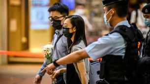 HONG KONG POLICE WARN RESIDENTS AGAINST MOURNING MAN WHO STABBED OFFICER