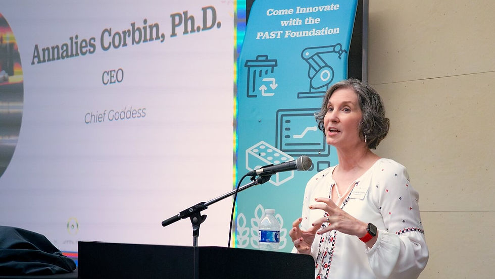 Annalies Corbin, Ph.D., CEO, speaks near a PAST Foundation banner. Come innovate with PAST Foundation.