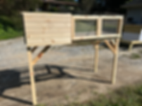 A quail coop built from pine and hardware cloth. 