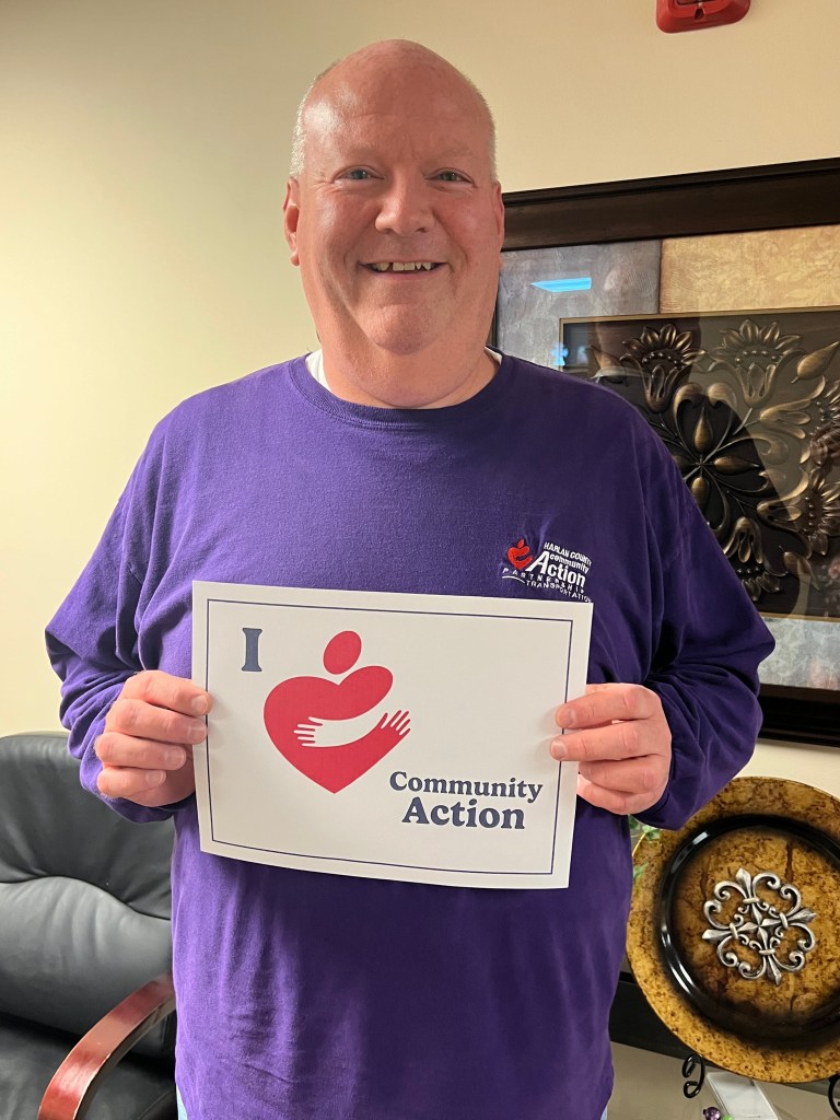 A blue square with the letter v on it.