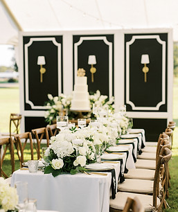 Large White Petitions with sconces used as backdrop for cake table.