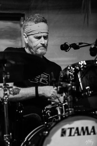 Drummer for McNulty's Fire Randy Ridenour peerforing on stage