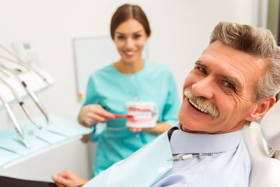 Adult patient sitting in the dental chair, ready for a cleaning