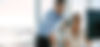 axonfintech-website-header-2-persons-couple-in-front-of-screen.jpg