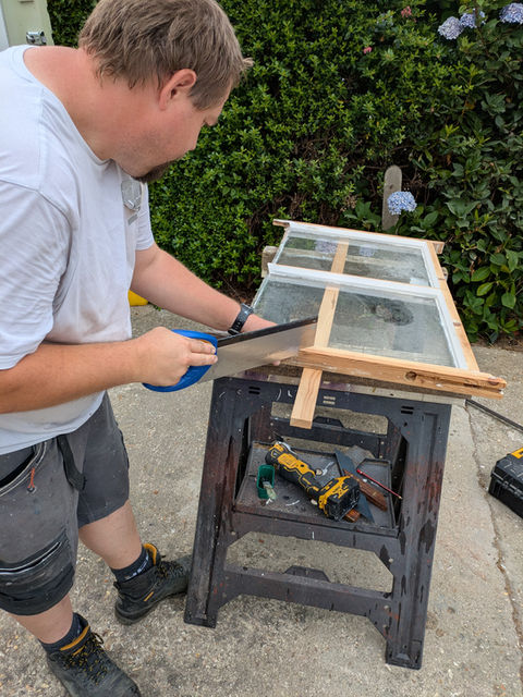 Jason in the midst of a custom sash window repair to the frame