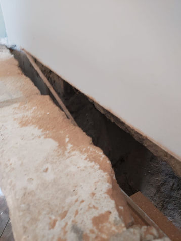 a white wall with a hole in it