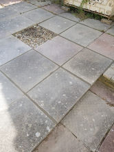a concrete walkway with a hole in the middle