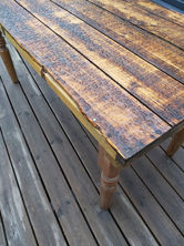a wooden table with water drops on it