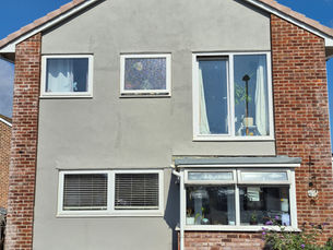 A freshly painted house exterior in warm grey