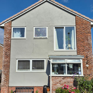 A freshly painted house exterior in warm grey