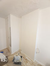 a corner of a room with white walls